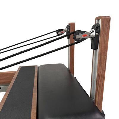 High stability Pilates Reformer apparatus supporting a wide range of Pilates exercises targeting core muscles and overall body fitness